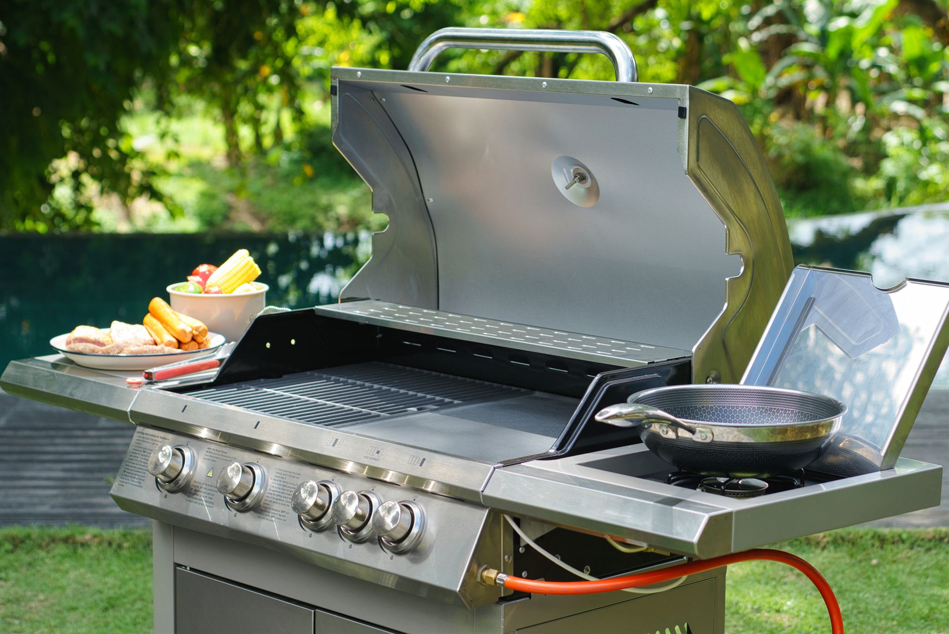 Full view of the grill, hood open, poolside at a Bali villa